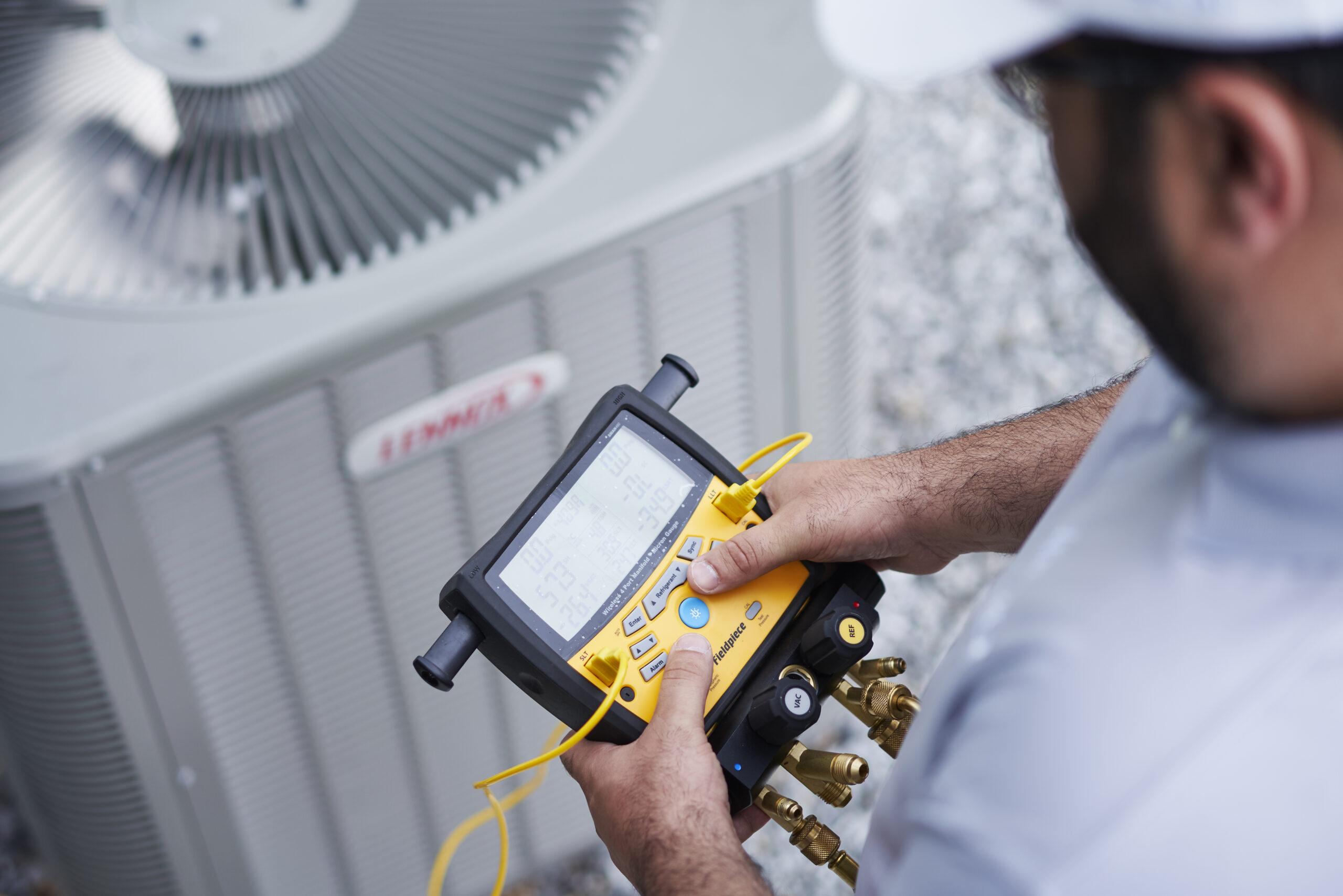 Nuvo HVAC technician inspecting HVAC system