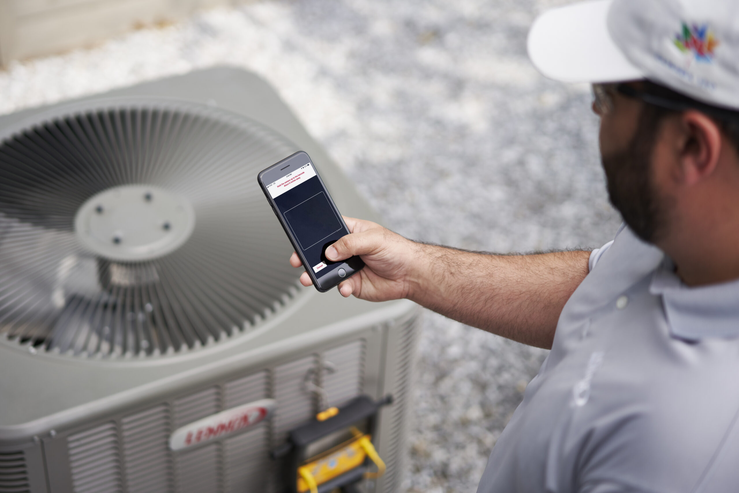 Technician evaluating Whole Home Air Purification components in a Highland Park, TX attic HVAC installation
