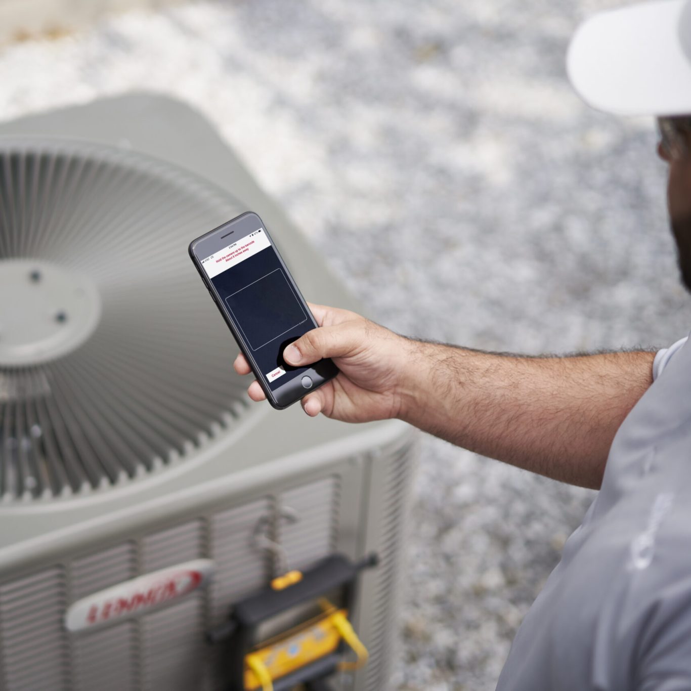 Technician evaluating Whole Home Air Purification components in a Highland Park, TX attic HVAC installation