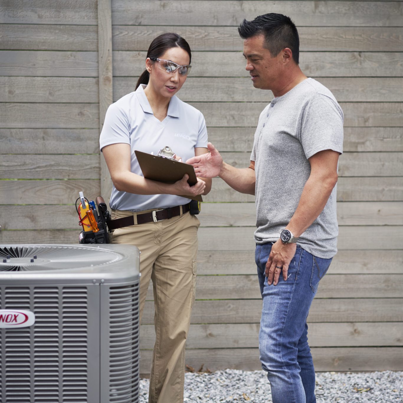 Skilled HVAC technician using diagnostic tools to optimize AC system performance in Highland Park, TX home