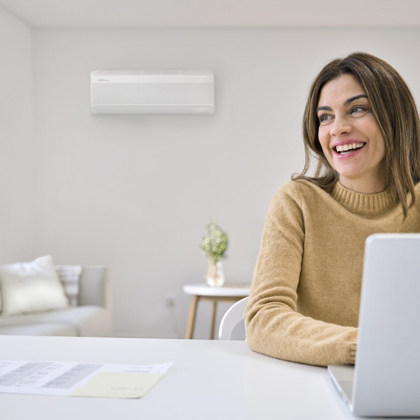 Nuvo HVAC technician precisely installing a new furnace in a modern Lakewood, TX home living room